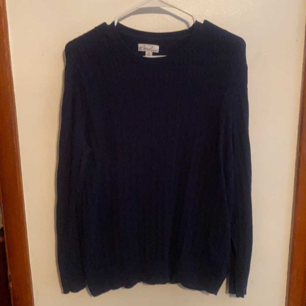 Kim Rogers navy blue sweater.